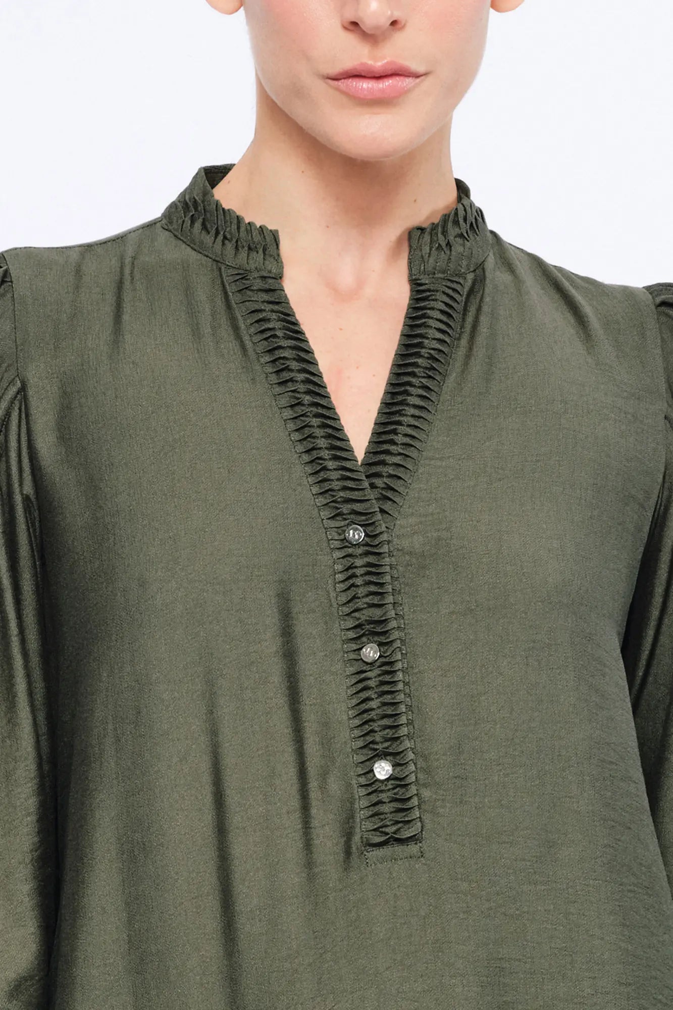 Detail shot of the sculptural puff sleeve construction on the Olive Carlie Dress.
