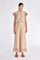 Clark Pant in Nude – Lightweight pants with diagonal patch pockets, elastic waistband, and subtle trim detail at the hem.