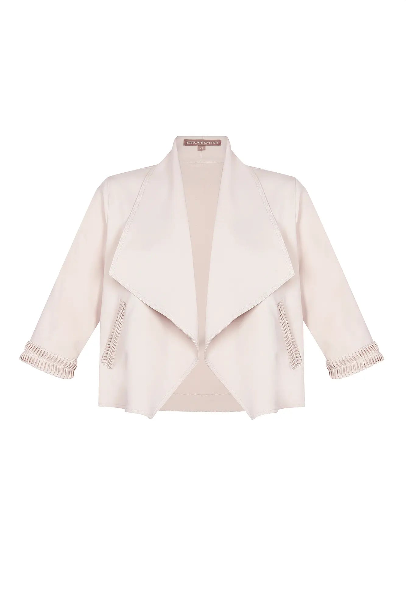 The Daysi Jacket in a natural Ecru, featuring its wide, draped lapel and relaxed silhouette.