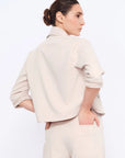 Elegant back view of the Daysi Jacket in Ecru.