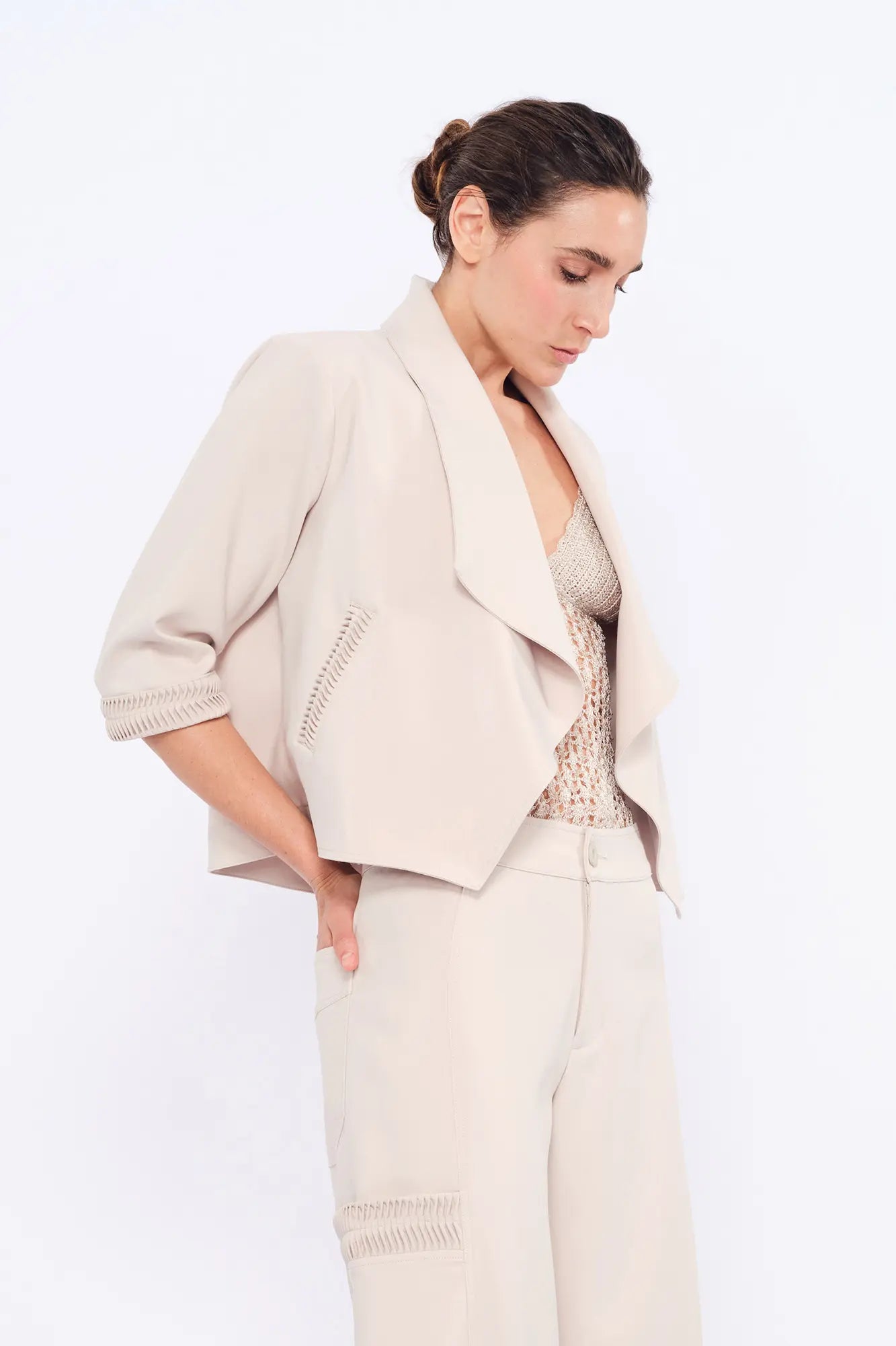 Side view of the Ecru Daysi Jacket, showcasing the graceful drape of its open-front design.