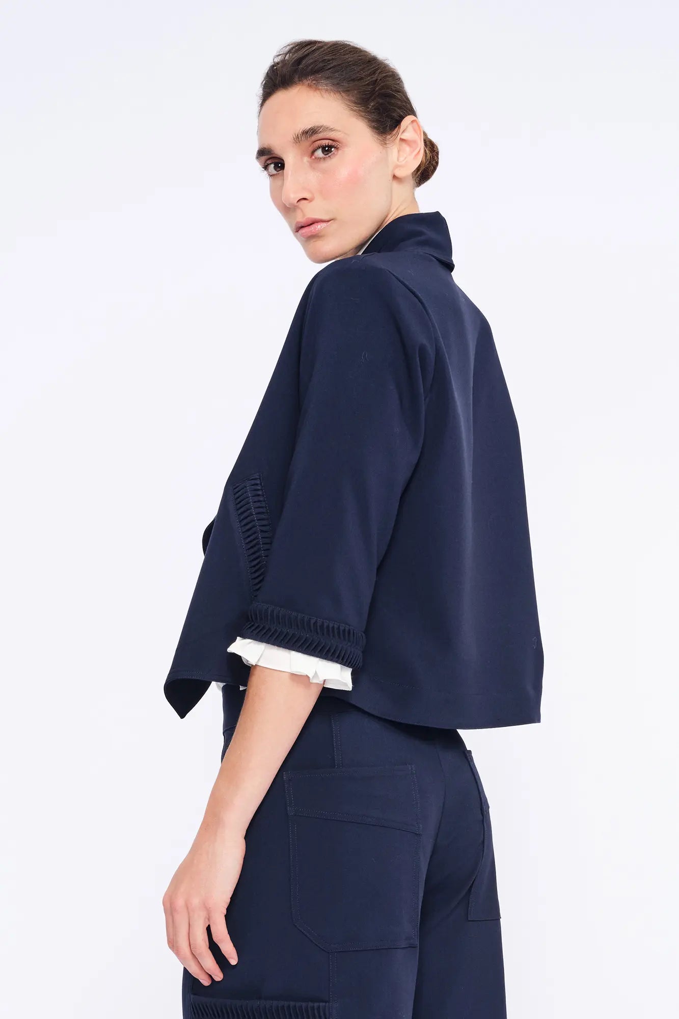 Side profile of the Navy Daysi Jacket, highlighting the fluid drape and three-quarter sleeves.