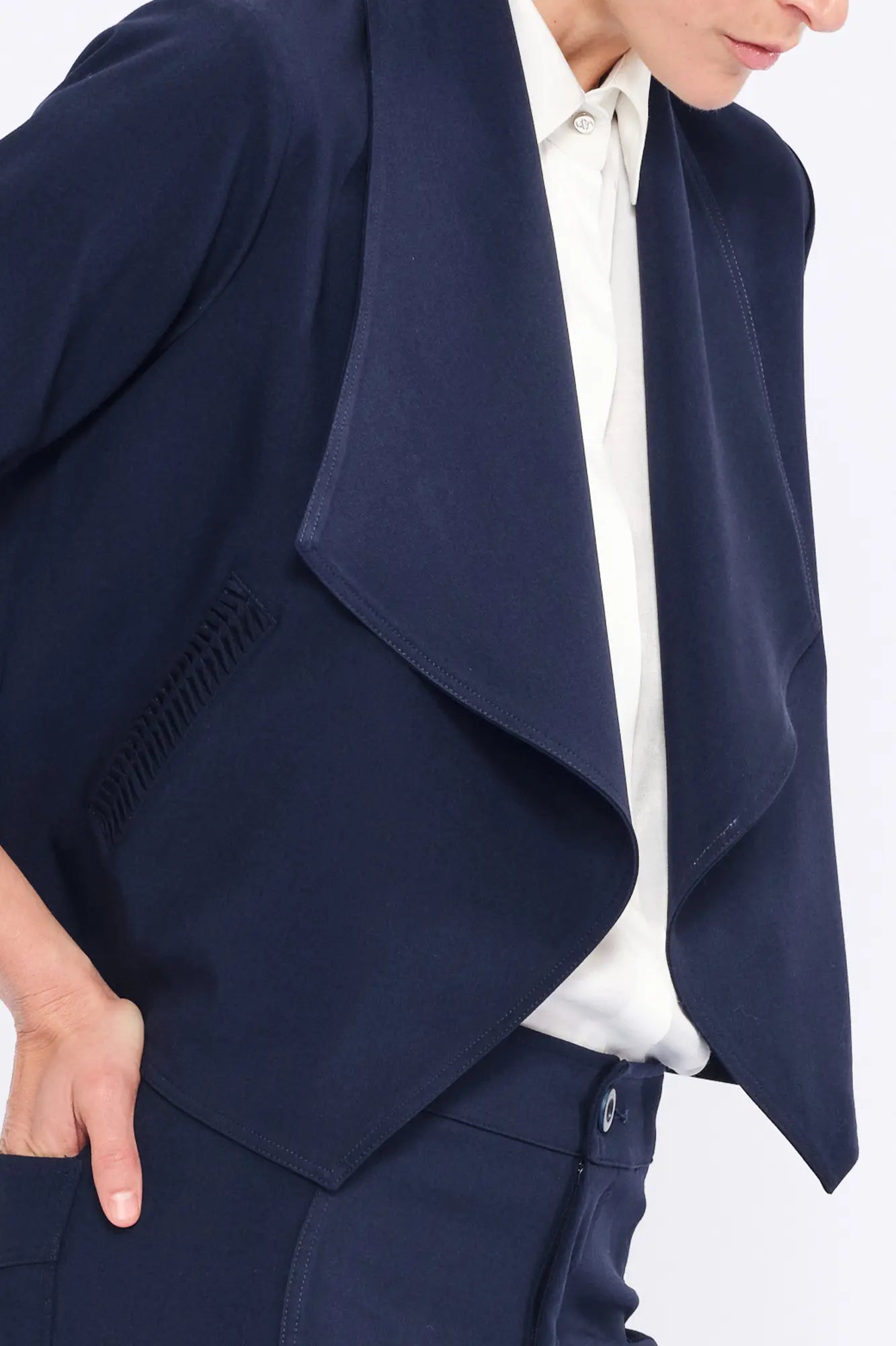 Close-up of the subtle gathered detail on the pocket of the Navy Daysi Jacket.