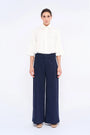 Front view of the Daysi Trouser in Ecru, showcasing its fluid wide-leg silhouette.
