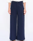 Front view of the Daysi Trouser in Ecru, showcasing its fluid wide-leg silhouette.