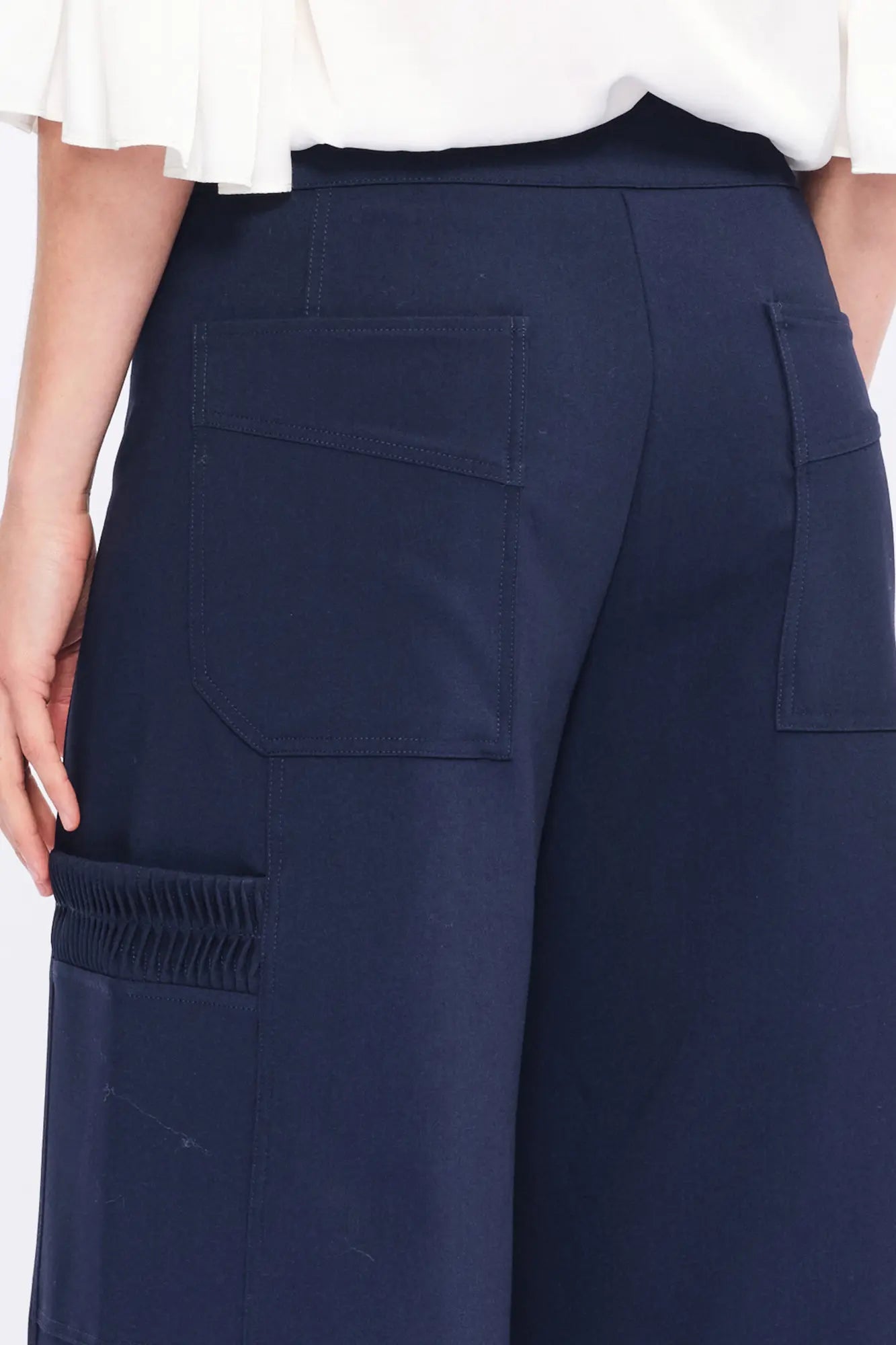Clean back silhouette of the Daysi Trouser, showing the impeccable fit of the waistband.