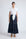 Eden Skirt in Navy – Cotton midi skirt with ruffled hem, front patch pockets, and elasticized back waistband.