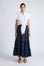 Eden Skirt in Navy – Cotton midi skirt with ruffled hem, front patch pockets, and elasticized back waistband.