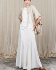 Elaine Poncho in Beige Melange with front patch pockets and dropped sleeves