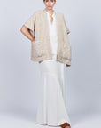 Elaine Poncho in Beige Melange with front patch pockets and dropped sleeves