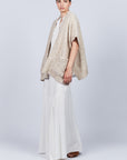 Elaine Poncho in Beige Melange with front patch pockets and dropped sleeves