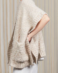 Elaine Poncho in Beige Melange with front patch pockets and dropped sleeves