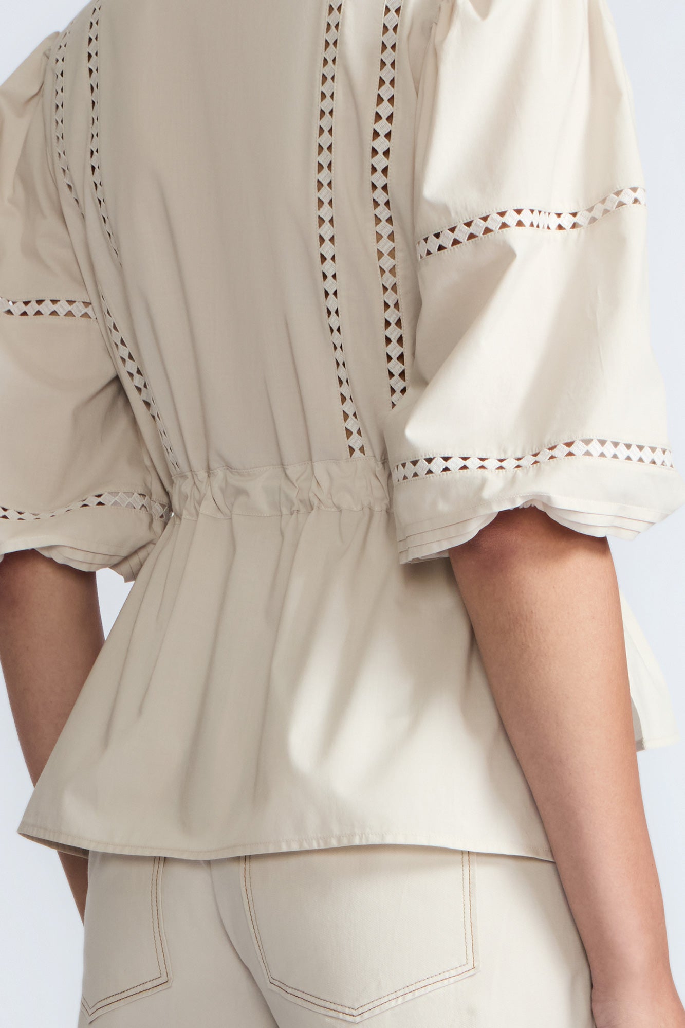 Evangeline Blouse in Prestine – 100% cotton blouse with internal belt, decorative trim, shirt collar, and ¾ sleeves with elastic cuffs.