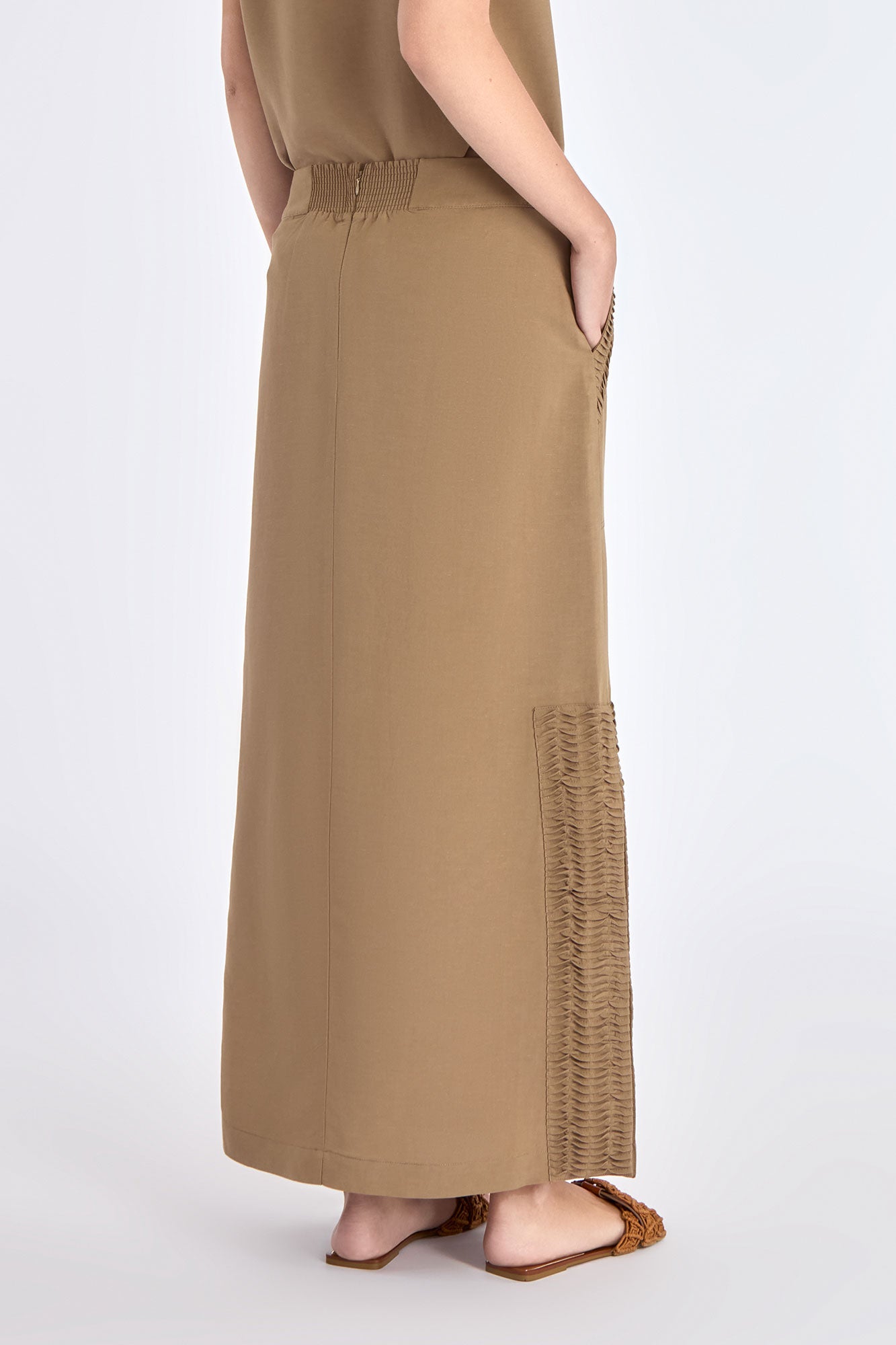 Back view of the Indigo Skirt, showcasing the smooth fit of the half-elasticated waistband.