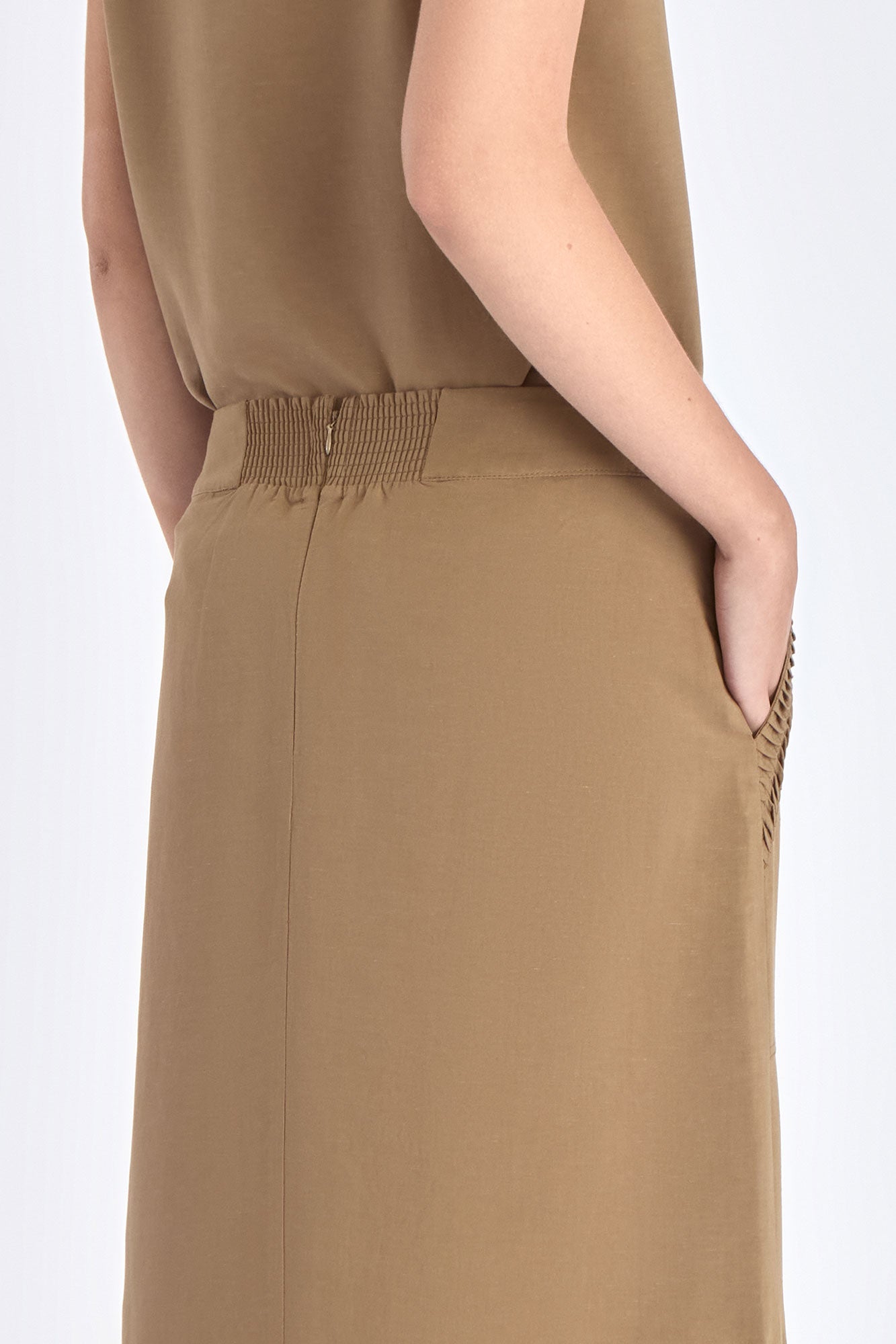 Back view of the Indigo Skirt, showcasing the smooth fit of the half-elasticated waistband.