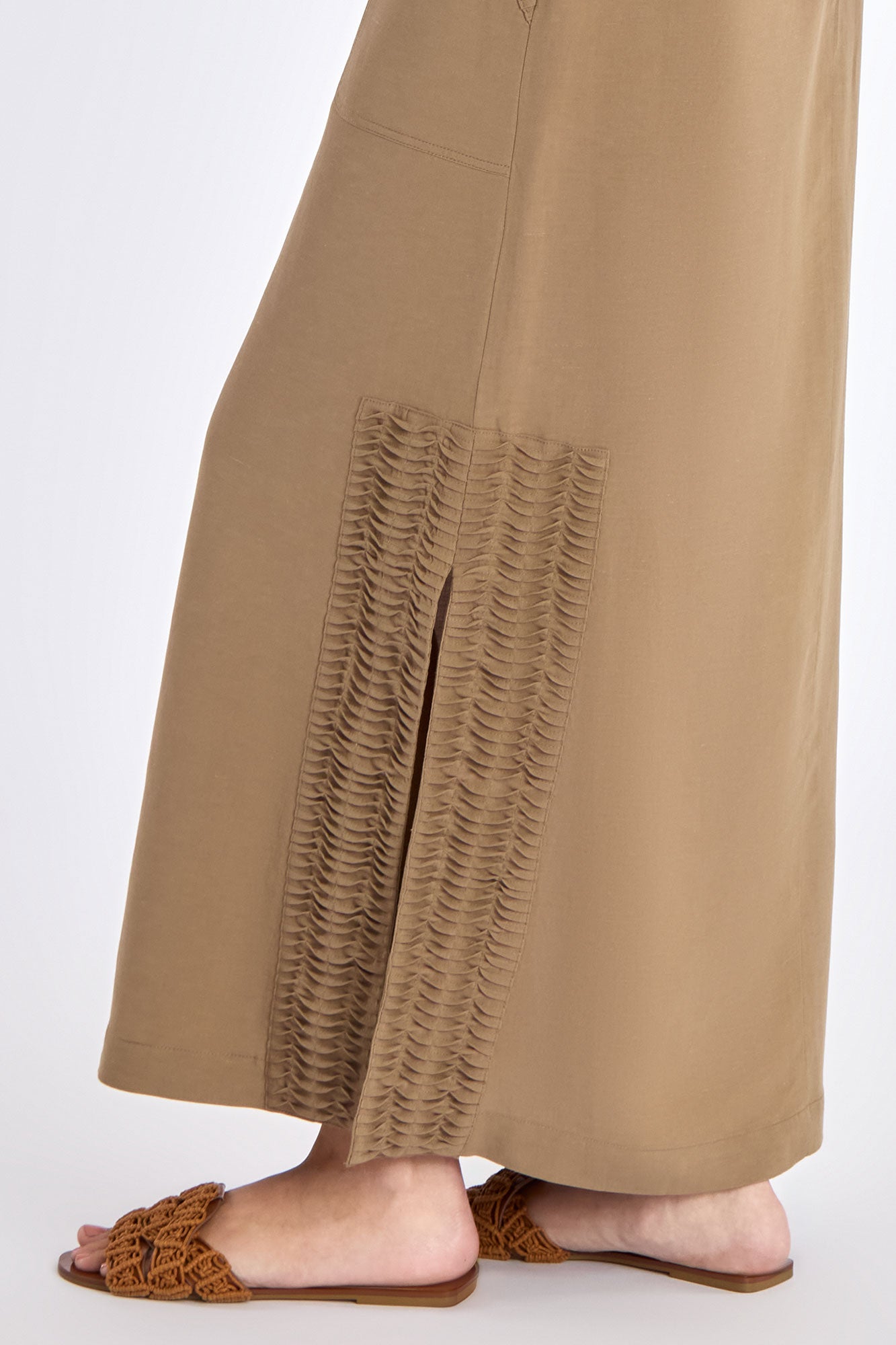 Close-up detail of the premium linen blend fabric and the angled patch pocket on the Taupe Indigo Skirt.