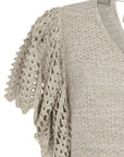 Knitted Alejandra Vest in Beige Melange with crochet ruffles and V-neck