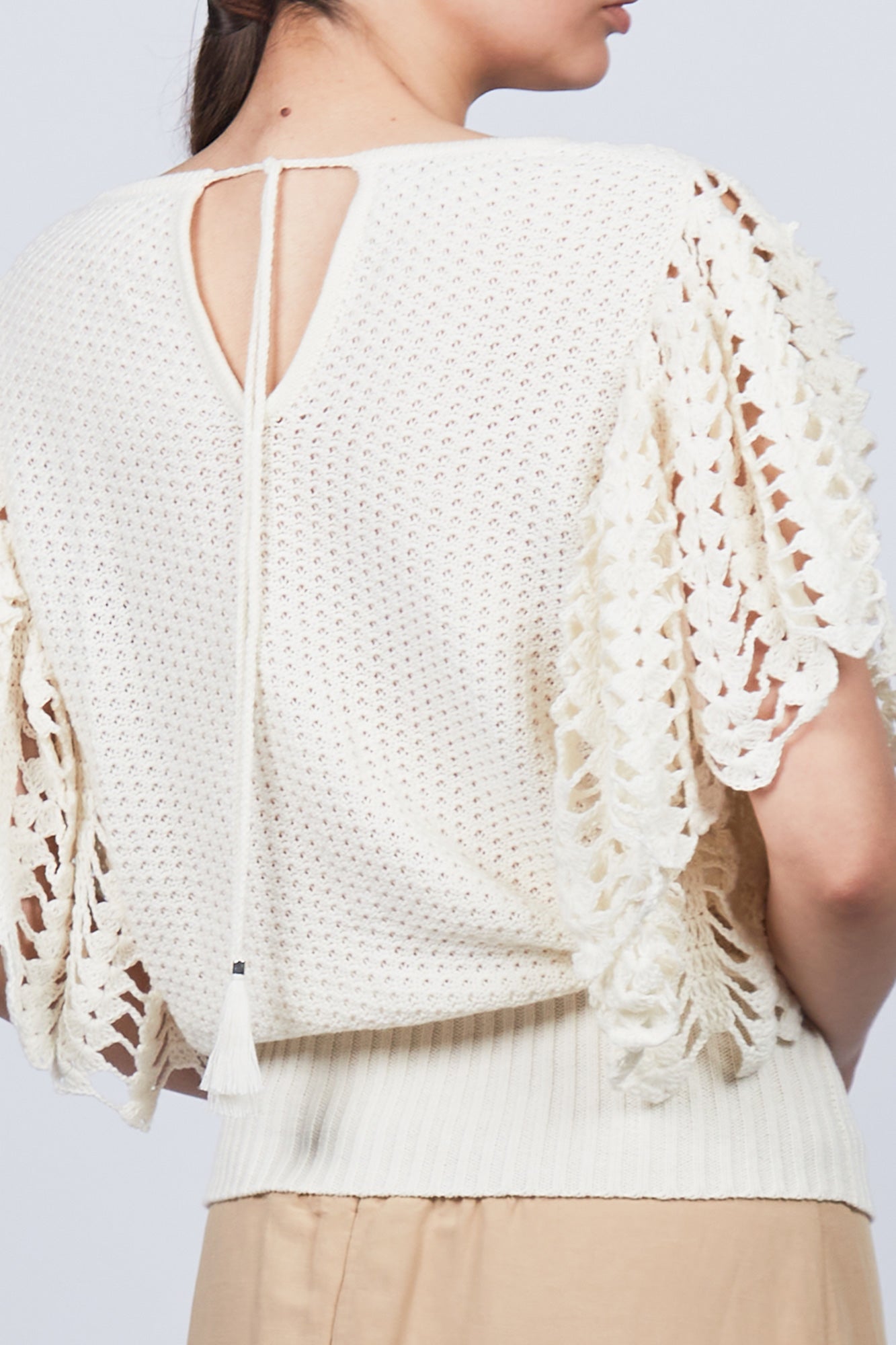 Knitted Alejandra Vest in Ivory Melange with adjustable tie and ruffles