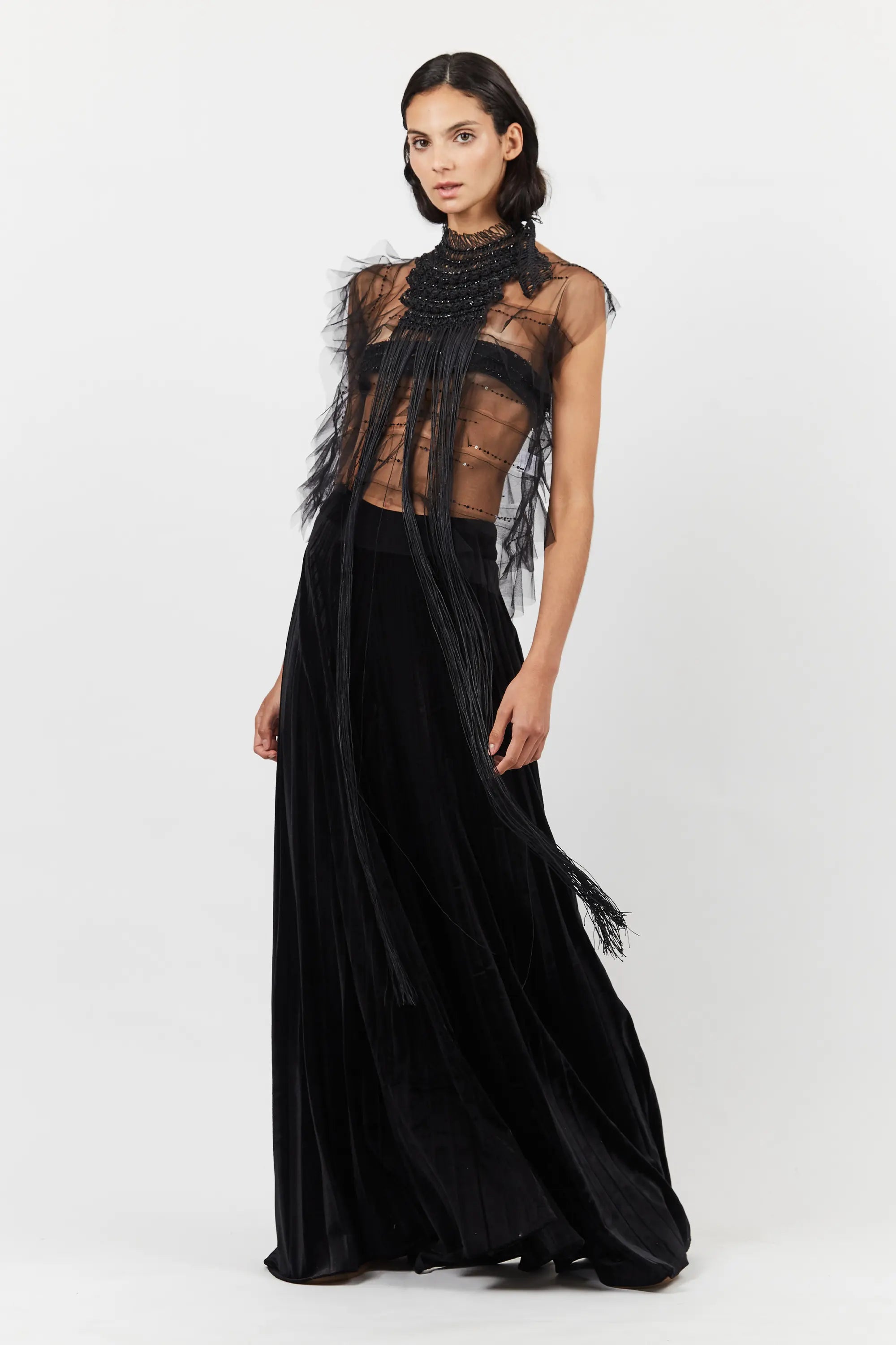 The Lara Peto in Black styled as an overlay on a complementary garment.