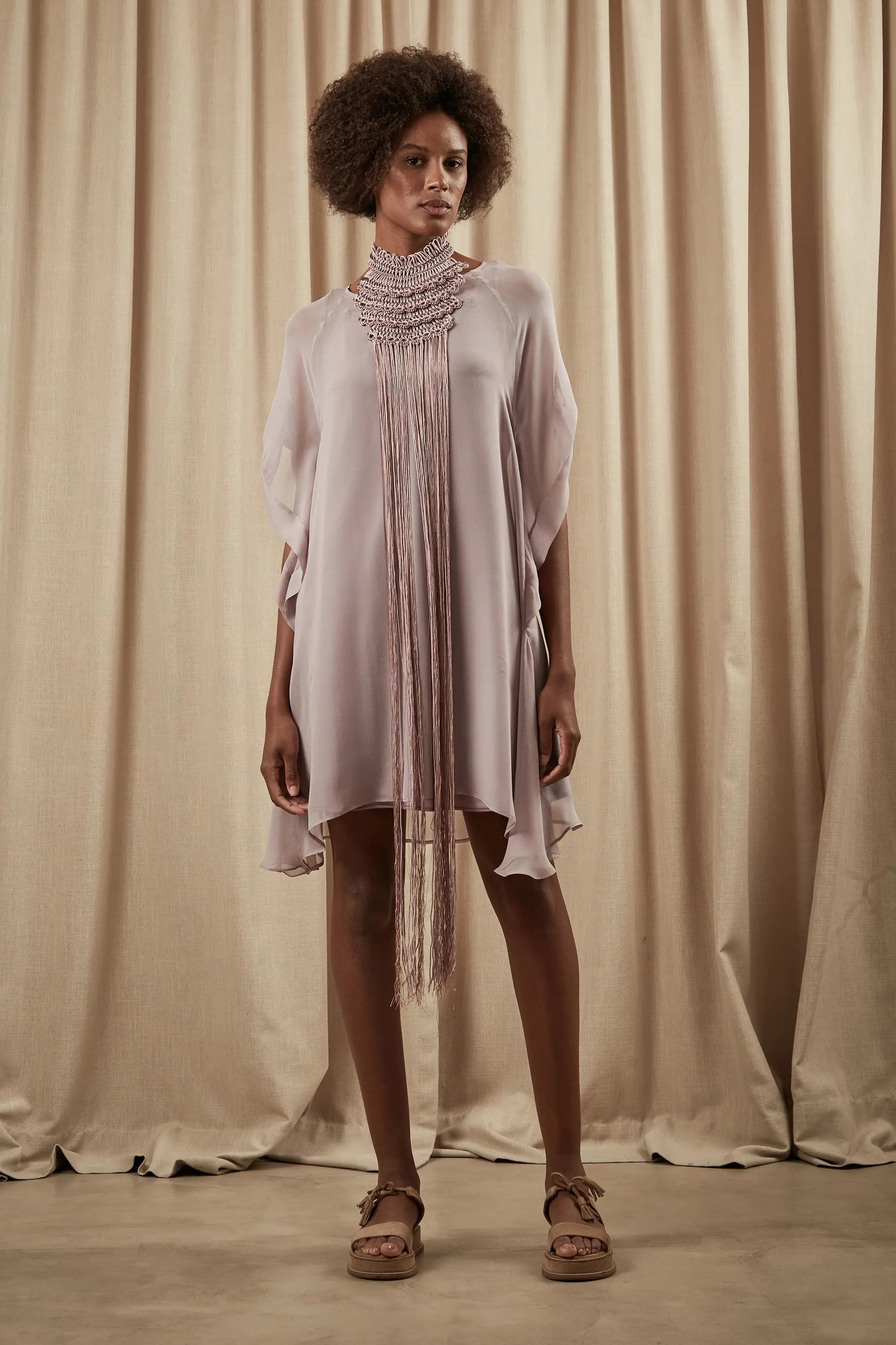 The Lara Artisan Macrame Peto in Rose, showcasing the full length and intricate knotwork.