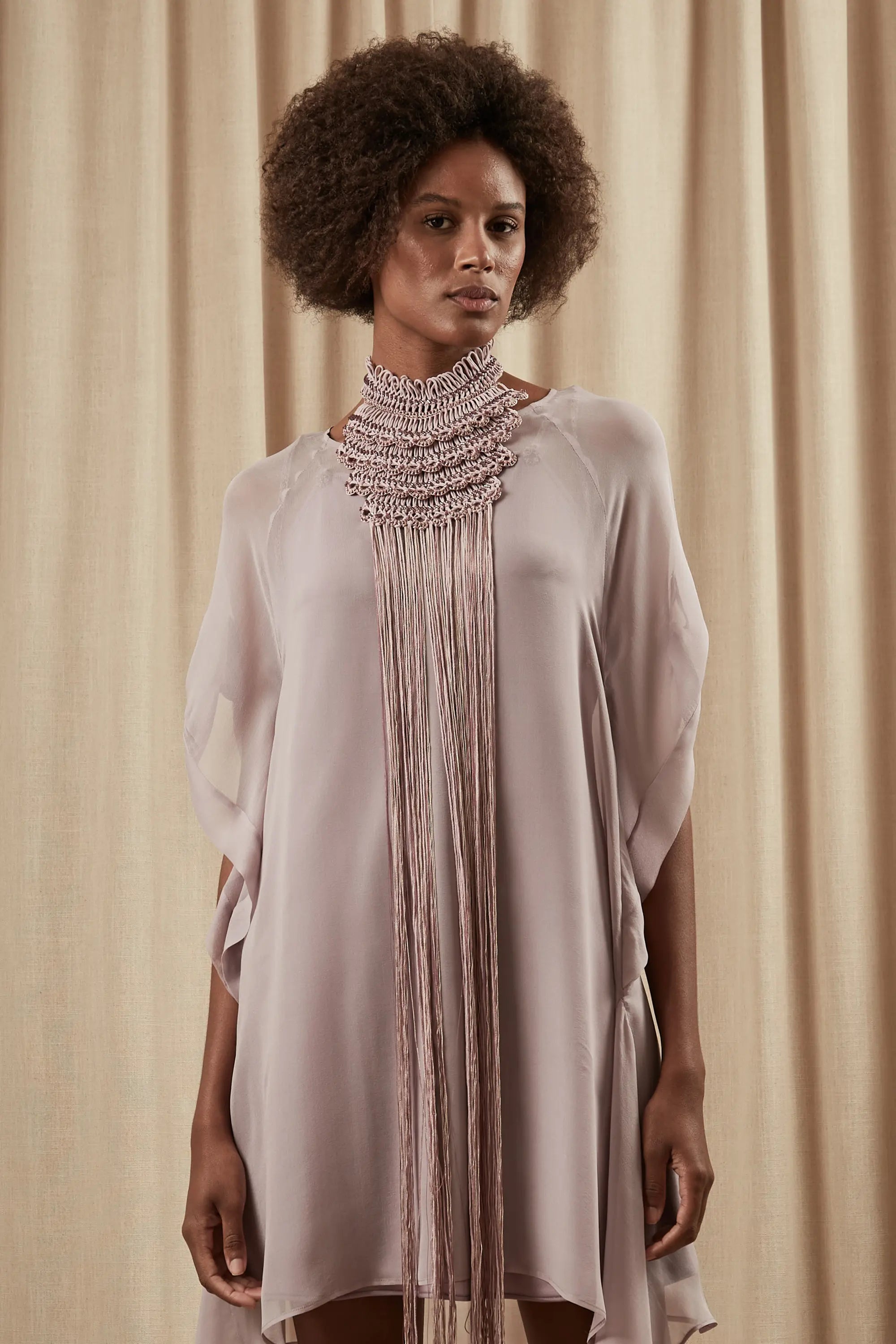 The Lara Artisan Macrame Peto in Rose, showcasing the full length and intricate knotwork.