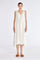 Model wearing the Lenox Godet Dress in Off White.