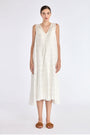 Model wearing the Lenox Godet Dress in Off White.