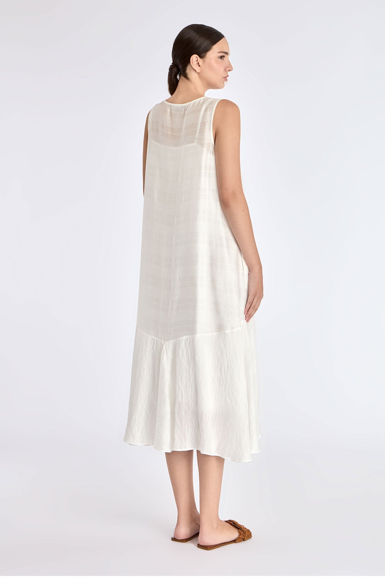Refined back silhouette of the Lenox Dress in Off White.