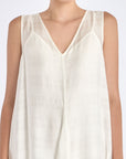 Close-up on the woven texture and godet panel seam of the Off White Lenox Dress.