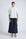 Lina Blouse in Light Blue – Cotton shirt with shirt collar, hidden button closure, ¾ balloon sleeves, and elastic cuffs.