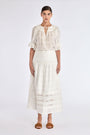 Model wearing the Luanda High-Waist Skirt in Off White.