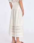 Back of the Luanda Skirt, showcasing the smooth high waistband and invisible zipper detail.