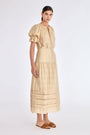 Front view of the Luanda Skirt in Vanilla, showcasing its high-waist and fluid midi silhouette.