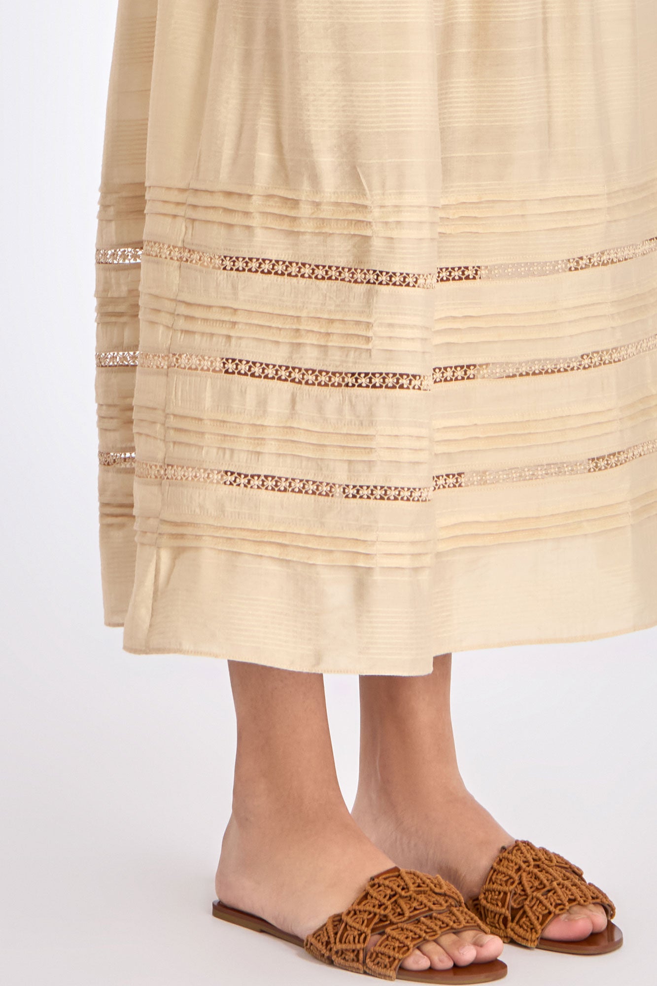 Close-up of the tonal trim and stitching detail on the hem of the Vanilla Luanda Skirt