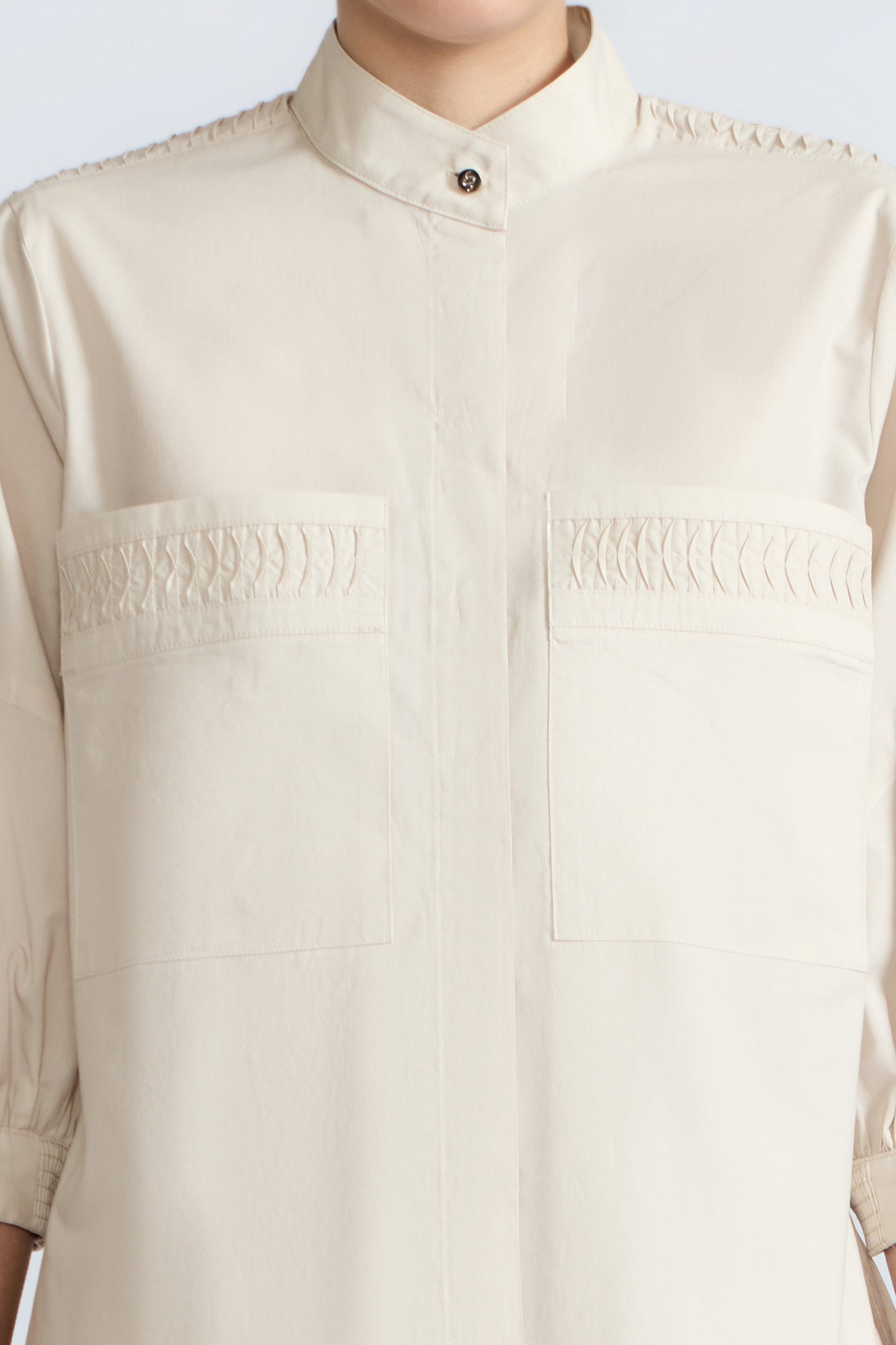 Magali Blouse in Prestine – Pima cotton blouse with Neru collar, hidden front buttons, patch pockets, and ¾ sleeves with semi-elastic cuffs.