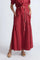 Model wearing the long Milena Maxi Skirt in a rich wine color.