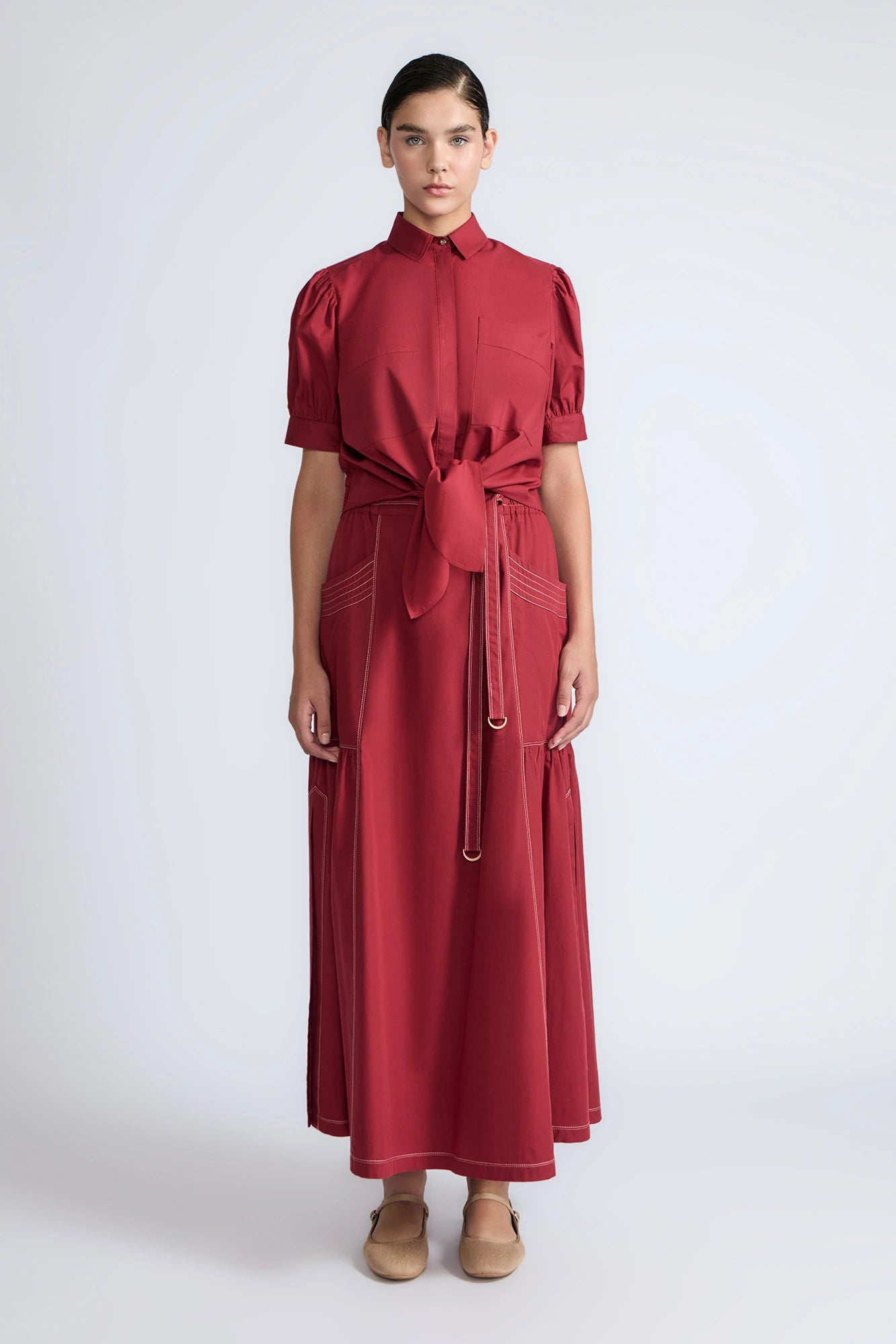 Model wearing the long Milena Maxi Skirt in a rich wine color.