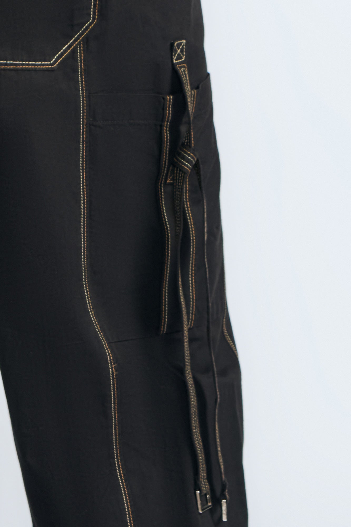 Paloma Pant in Off White – Relaxed cotton pants with patch pockets, contrast stitching, and side ties for a chic silhouette.