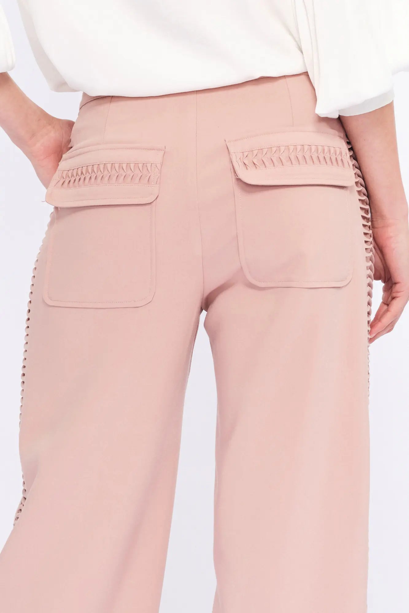 Back view of the Parker Trouser, detailing the elegant patch pockets with hemstitch accents.