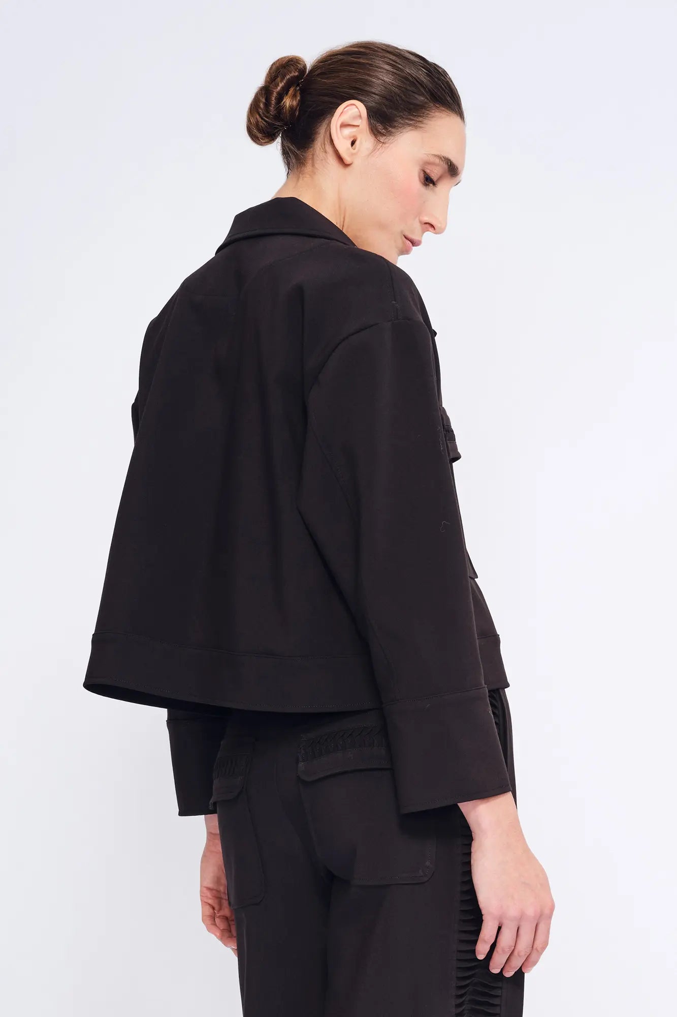 Elegant back view of the black Parker Jacket, highlighting its clean, tailored lines.
