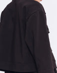 Elegant back view of the black Parker Jacket, highlighting its clean, tailored lines.