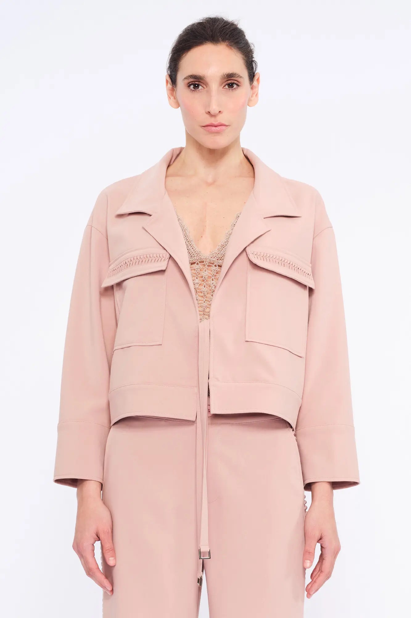 Front view of the Parker Jacket in Rose, showcasing its versatile tie-front design and tailored collar.
