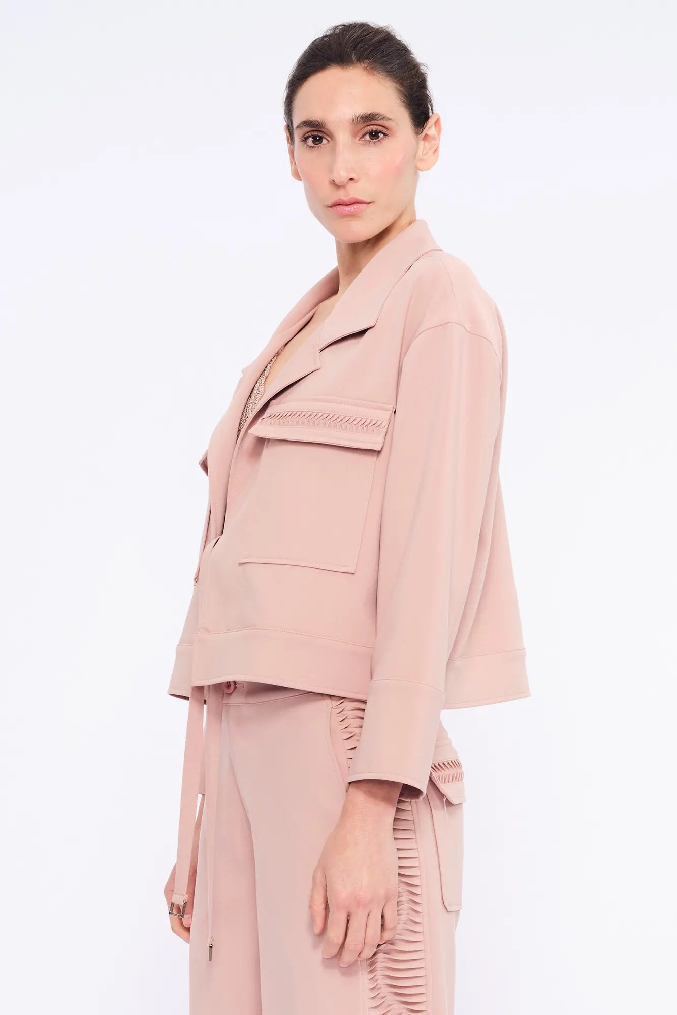 Side profile of the Rose Parker Jacket, highlighting its modern waist-length silhouette.