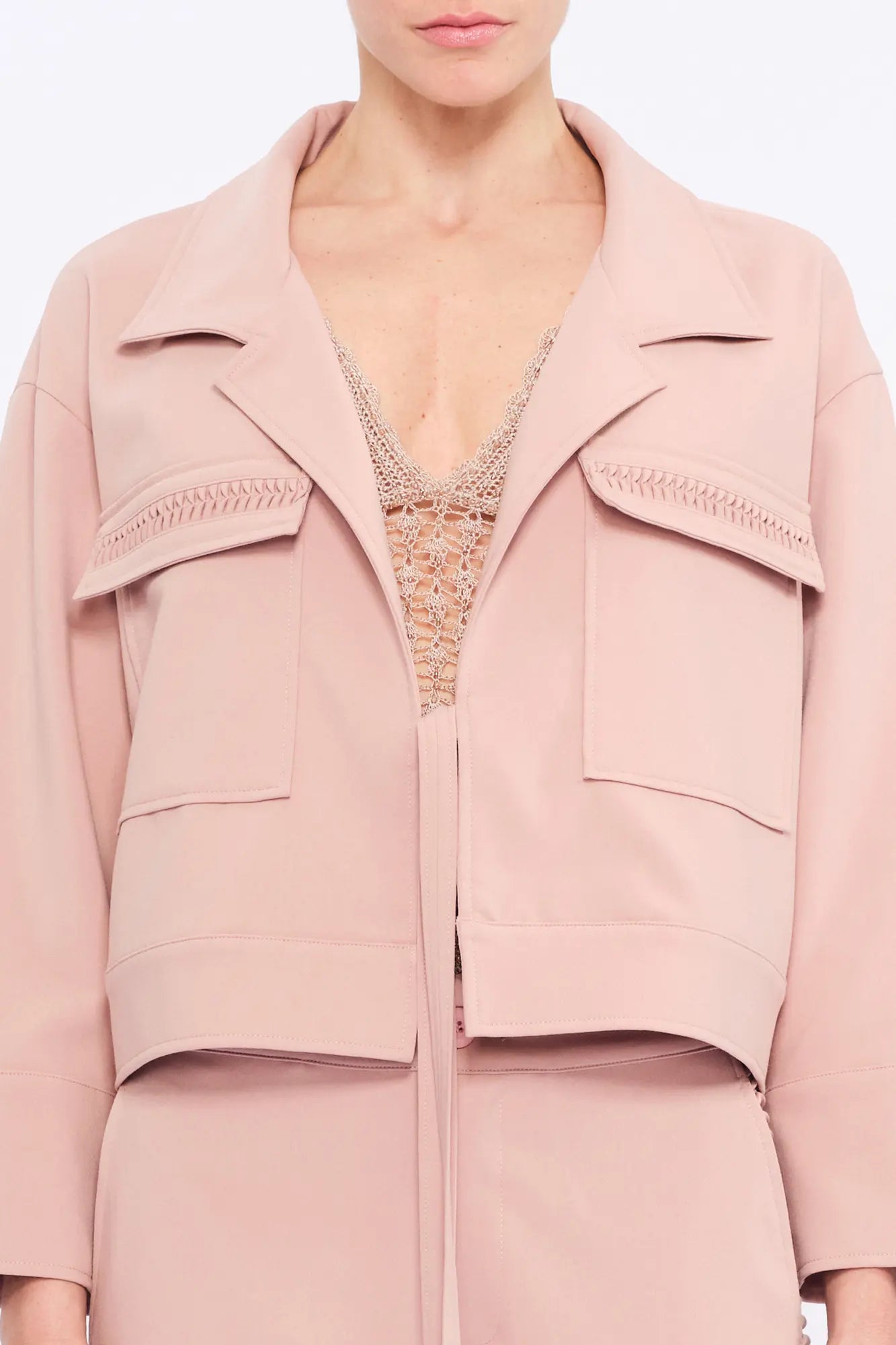  Close-up of the soft, raised gathered detail on the flap pocket of the Rose Parker Jacket.