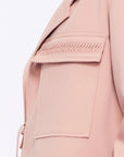 Close-up of the soft, raised gathered detail on the flap pocket of the Rose Parker Jacket.