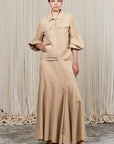 Penny Skirt in Camel with a high-waisted flowing design, ideal for versatile styling and timeless elegance.