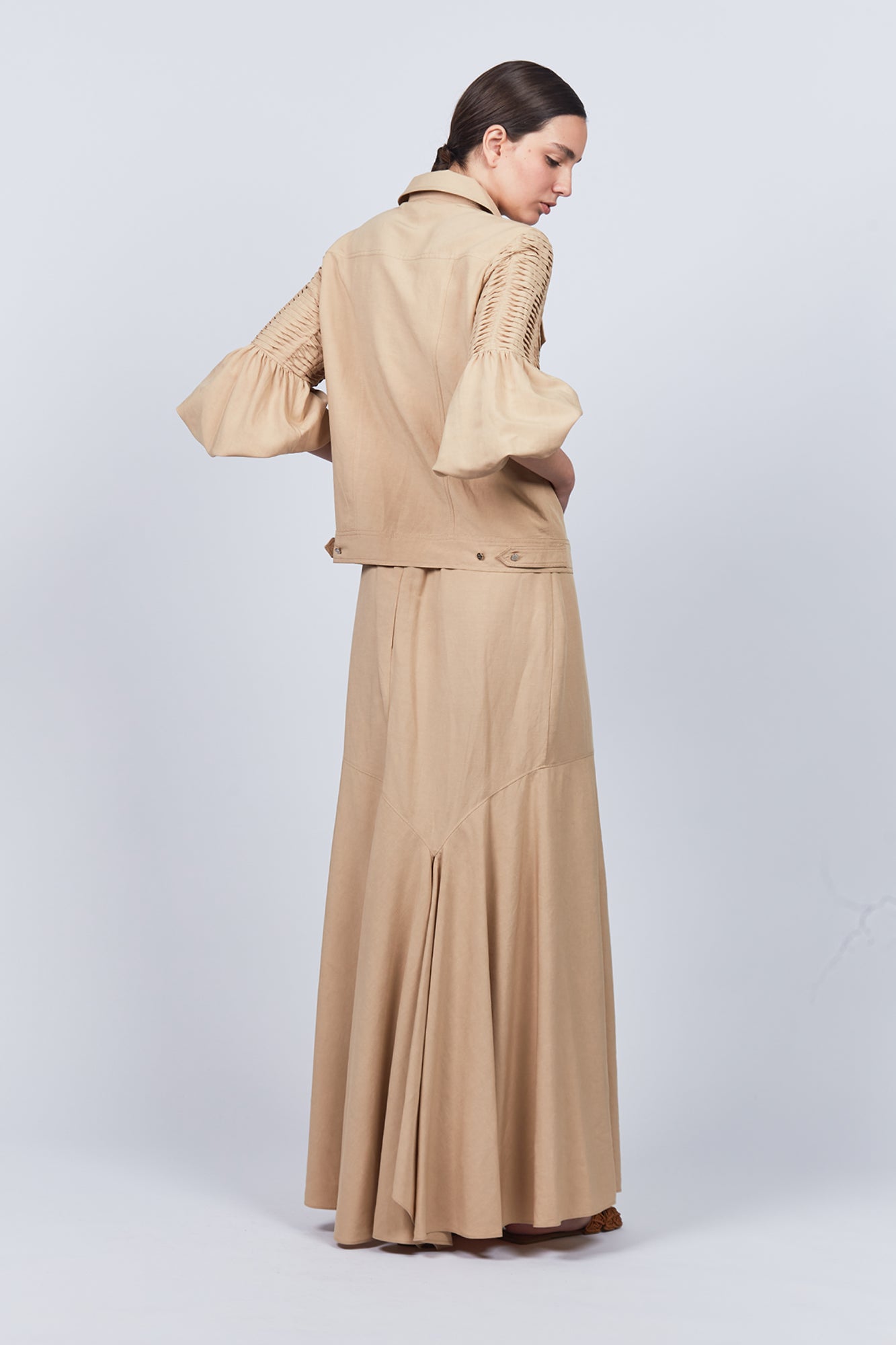 Penny Skirt in Camel with a high-waisted flowing design, ideal for versatile styling and timeless elegance.