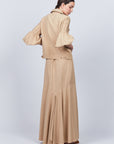 Penny Skirt in Camel with a high-waisted flowing design, ideal for versatile styling and timeless elegance.