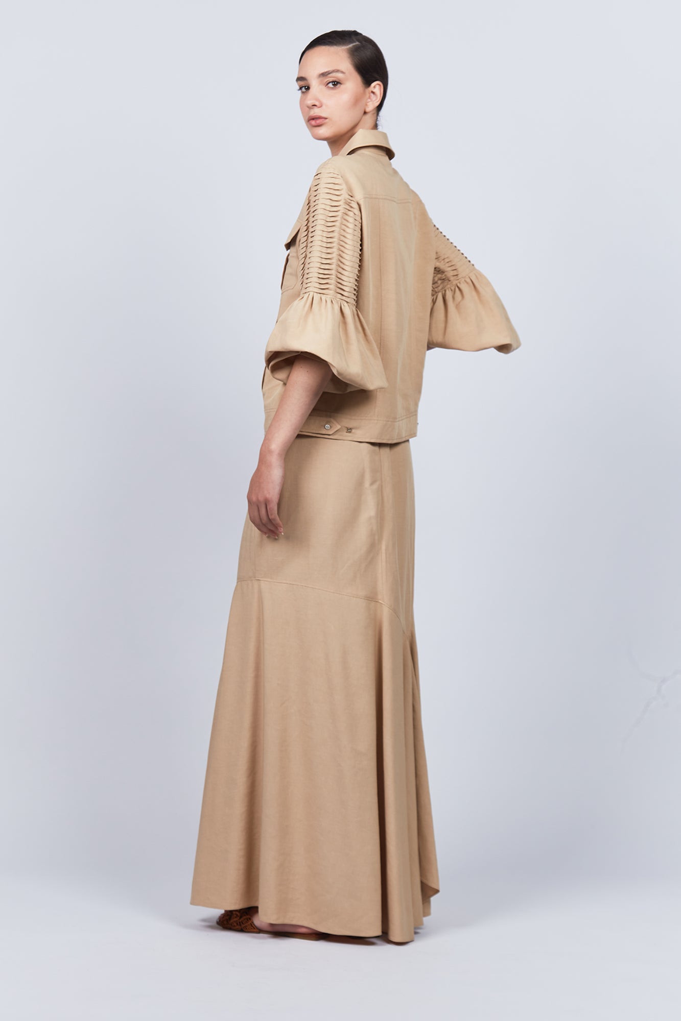 Penny Skirt in Camel with a high-waisted flowing design, ideal for versatile styling and timeless elegance.