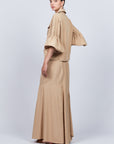 Penny Skirt in Camel with a high-waisted flowing design, ideal for versatile styling and timeless elegance.